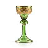 attributed to LUDWIG MOSER & SOHNE, A GILT, JEWELED, AND ENAMEL DECORATED GREEN GLASS GOBLET,