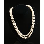 A DOUBLE STRAND AKOYA CULTURED PEARL NECKLACE WITH A 14K WHITE GOLD AND DIAMOND CLASP, comprising