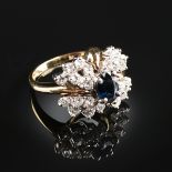 A 14K YELLOW GOLD, DIAMOND AND SAPPHIRE LADY'S RING, centering one prong set oval blue sapphire.