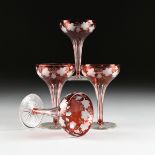 A SET OF FOUR BOHEMIAN RUBY FLASHED GLASS CHAMPAGNE COUPES WITH CUT AND ETCHED DECORATION, CIRCA