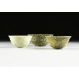 A GROUP OF THREE FOOTED JADE BOWLS, CHINESE, ATTRIBUTED TO THE REPUBLIC PERIOD (1912-1949), each