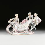 A CONTINENTAL GILT AND POLYCHROME ENAMEL DECORATED BISQUE PORCELAIN FIGURAL CENTERPIECE, EARLY