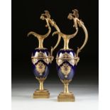 A PAIR OF CHINESE EXPORT PARCEL GILT ENAMELED AND ORMOLU MOUNTED COBALT PORCELAIN EWERS, BY UNITED