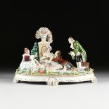 A V.E.B. SITZENDORFER PORZELLANMANUFAKTUR GILT AND POLYCHROME ENAMEL DECORATED PORCELAIN FIGURAL