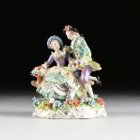 A V.E.B. SITZENDORFER PORZELLANMANUFAKTUR GILT AND POLYCHROME ENAMEL DECORATED PORCELAIN FIGURAL