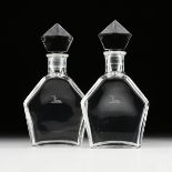 A PAIR OF BACCARAT MOLDED AND CUT CRYSTAL BOTTLES/DECANTERS FOR THOMAS HINE & CO., CIRCA 1965-