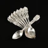 A SET OF NINETEEN REED & BARTON STERLING SILVER MELON SPOONS IN THE "FRANCIS I" PATTERN, TAUNTON,