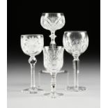 A GROUP OF FOUR AMERICAN, BRITISH, AND CONTINENTAL CLEAR CUT CRYSTAL WINE STEMS, CIRCA 1900-1990,