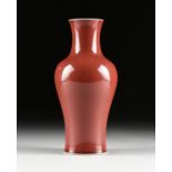 A CHINESE EXPORT OXBLOOD GLAZED PORCELAIN VASE, AFTER 1950, with flared rim, over a tapered neck,