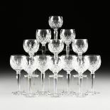 A SET OF THIRTEEN WATERFORD CLEAR CUT CRYSTAL BALLOON WINE GLASSES IN THE "LISMORE" PATTERN,