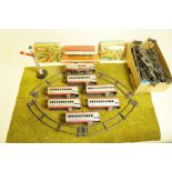 A Marx tin plate clockwork train set with Union Pacific loco, six carriages, station, tunnel, signal