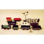 A Hornby clockwork locomotive and tender, various wagons and trucks, signal box etc