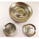 A pair of brass dishes embossed soldier and bulldog - 12cm dia and a larger dish - 25cm dia,