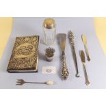 A small group of silver items including book cover, button hook, shoe horn etc