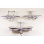 A set of three aluminium model aeroplanes - a Mosquito, Lightning and Islander (?) - 18cm approx