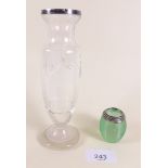 A small green glass silver rimmed match striker and a silver topped vase