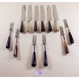 A set of six horn handled knives and forks - the blades by Parkin and Marshall