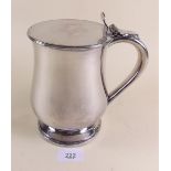 A large silver plated lidded tankard