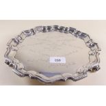 A silver pie crust edge salver with three scroll feet, Sheffield 1923, by Martin Hall & Co, 650 g