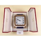 A Cartier travel alarm clock in original box Serial no. 7508 09890