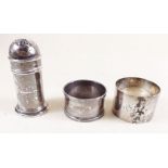 A silver pepper pot with blue glass liner and two silver napkin rings - approx 74g