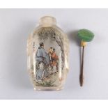 A Chinese antique glass snuff bottle reverse painted figures with script to verso