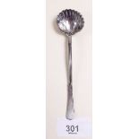 A heavy silver shell form spoon 12cm