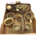 A box of brassware including pestle and mortars