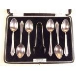 A cased set of six silver coffee spoons and tongs, 1923