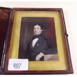 An early 19th century watercolour miniature 3/4 portrait of a young man in fitted leather case -