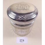 A cut glass and silver dressing table jar