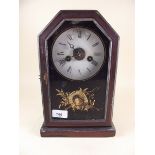 An American shelf clock with jockey hat and whip decoration painted to door