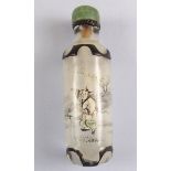 A Chinese antique glass snuff bottle carved cameo border and reverse painted figure in a garden,