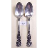 A pair of American silver serving spoons by Gorham with shell engraved terminals, 1904, 149g