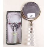 A magnifying swivel hand mirror with glass handle and an oriental magnifying glass - boxed