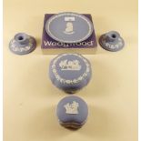 A pair of Wedgwood Jasperware candlesticks and two trinket boxes