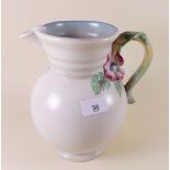 A Clarice Cliff large jug with floral handle 22cm tall
