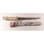 A Japanese bone tanto or short sword with all over carved decoration