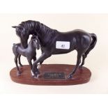 A Beswick group Black Beauty and foal on wooden base