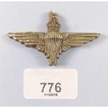 A WWII plastic economy parachute regiment cap badge c. 1943 - 45
