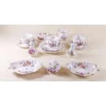 A Royal Crown Derby 'Derby Posies' group of tea ware comprising: three cups and saucers, jug and