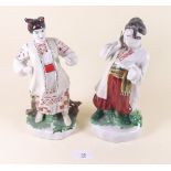 A pair of Russian porcelain figures of peasants 24cm