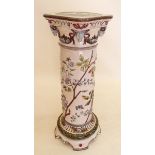 A large Austrian Majolica column or jardiniere stand decorated rams heads, flowers and birds on a