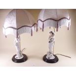 A pair of composite figurative table lamps and shades