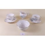 A Royal Osbourne tea service comprising: six cups and saucers, six tea plates, milk and sugar,