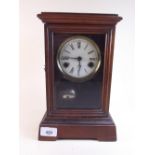 An architectural style mantel clock with interior bell