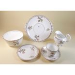 A Victorian tea service painted moss rose and heather comprising nine cups and saucers, two cake