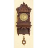 A Victorian architectural style mahogany wall clock with carved decoration and gilt face