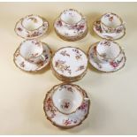 A Hammersley floral painted part tea service comprising six cups, nine saucers and eight tea plates