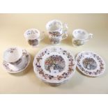 A collection of Royal Doulton Brambly Hedge items including the four seasons plates, mugs and Autumn